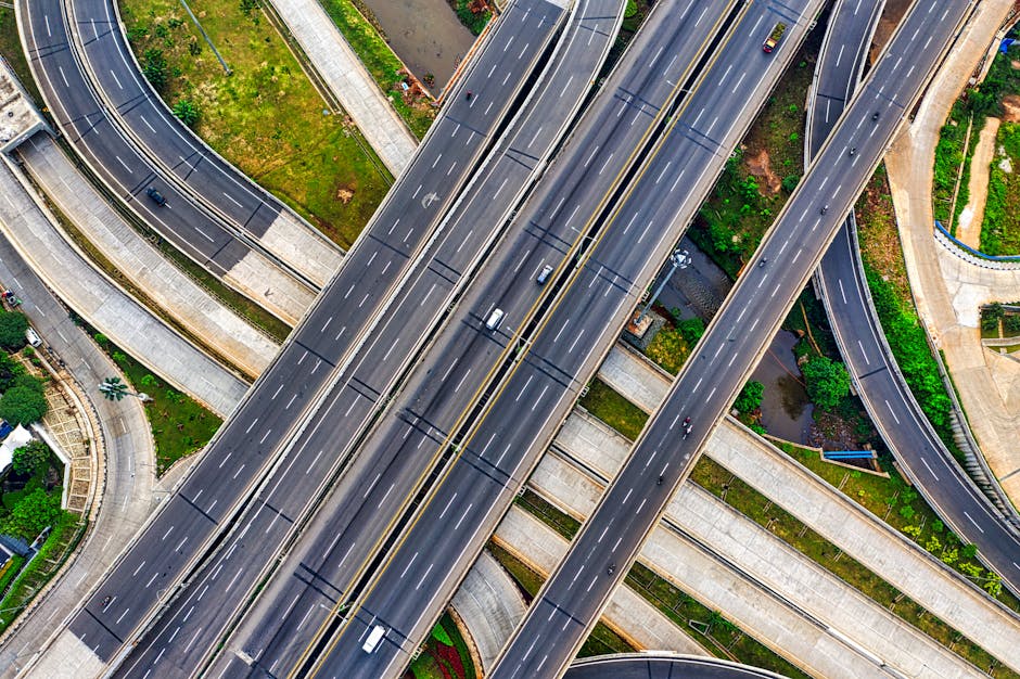 Aerial view of a complex highway interchange in South Jakarta, Indonesia, depicting urban infrastructure.
