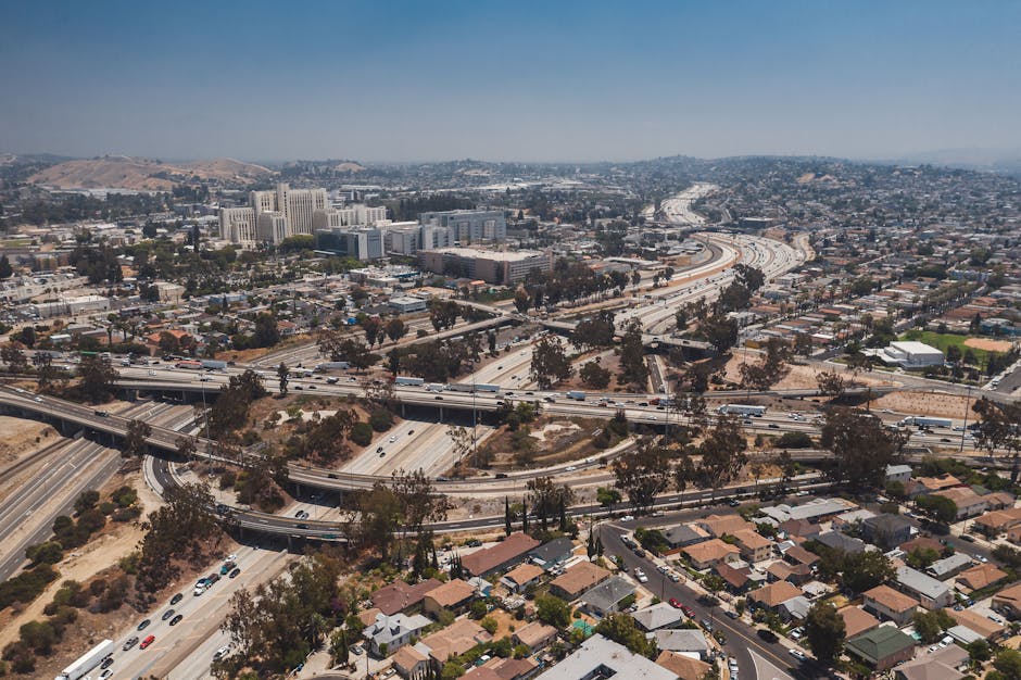 Aerial shot of intricate highway interchanges in Los Angeles, showcasing urban sprawl and traffic flow.